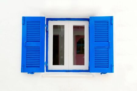 Blue window with white wall of official place.の写真素材