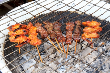 Chicken and liver skewers grilled on charcoal.の写真素材