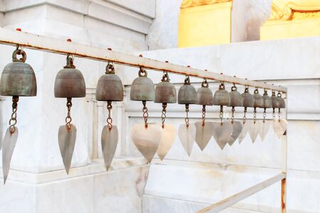 Lots of small bells hanging in the thai church の写真素材