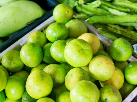 Lime put stacked in the market for sale.の写真素材