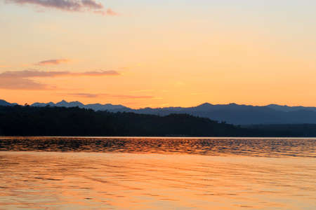 The sun was falling in the early evening sky is red.の写真素材