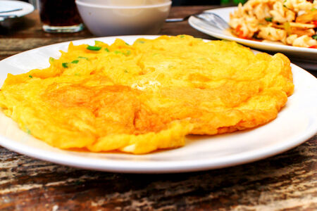 Thailand style omelet served on a plate.の写真素材