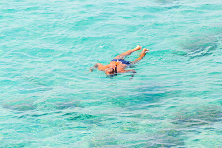 Active people swimming in the sea water. の写真素材