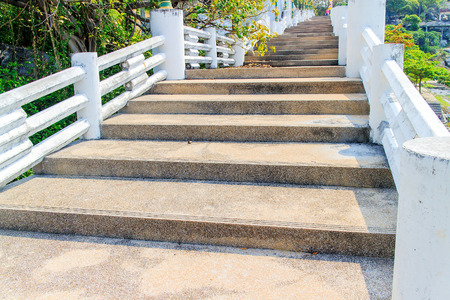 Old concrete stairs is the overpass in the sea view.の写真素材