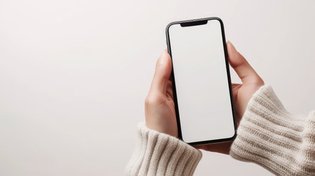 Showcase your digital content with a mobile phone mockup featuring a blank white screen in a human hand. Ai Generatedの素材