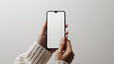 Showcase your digital content with a mobile phone mockup featuring a blank white screen in a human hand. Ai Generatedの素材