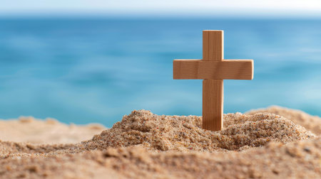 Wooden cross on the beach symbolizes faith, with tranquil sea waves creating a peaceful backdrop for reflection.の素材
