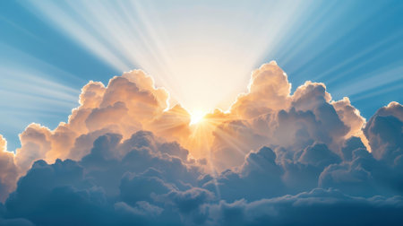 Radiant sun rays cascade from the clouds, illuminating the blue sky, evoking a sense of peace and divine presence in nature.の素材