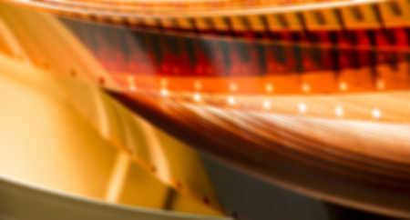 Blurred film reel on orangeの写真素材