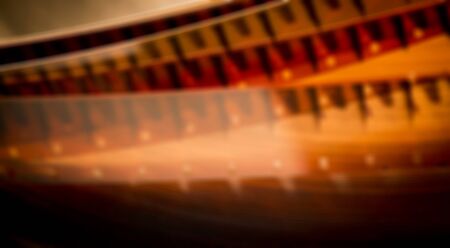 Blurred film reel on orangeの写真素材