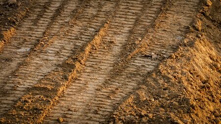 Wheel print on red soilの写真素材