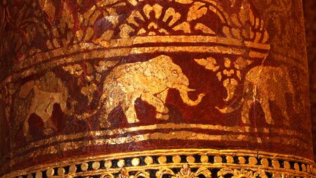 gold Elephant red background in thai muralの写真素材