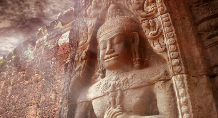 Peaceful Dvarapala sculpture at Preah Khan in flare lighting , Angkor Wat