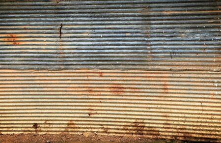 rusted metal exterior of an old building.