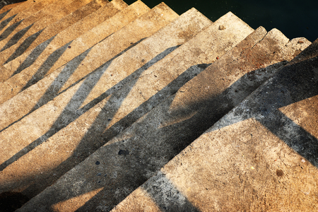 grunge shadow of concrete stair in a public park at the daylight.の写真素材