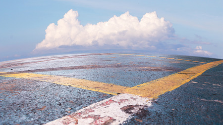 dirty outdoor sport court and white cloudの写真素材