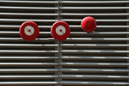 Red fire alarm on wall