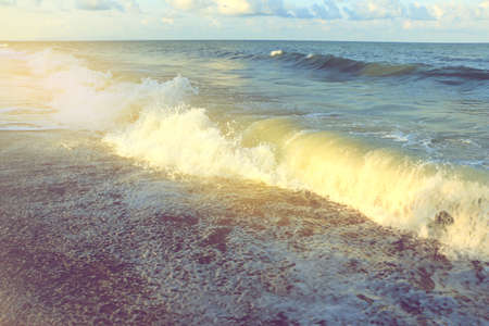 wave of the sea on the beach with sunlight in South of Thailandの写真素材