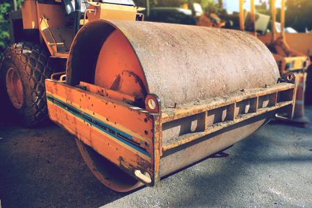 road roller compactor parked at road construction siteの写真素材