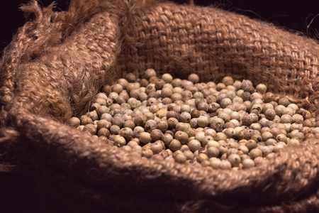 white pepper dry seed on brown sack sale on market in Thailandの写真素材