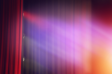 Red curtain theater background with lightの写真素材