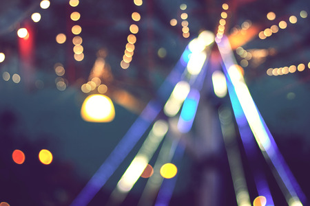 blurred colorful bokeh with glittering shine lights background, light christmas celebration on treeの写真素材
