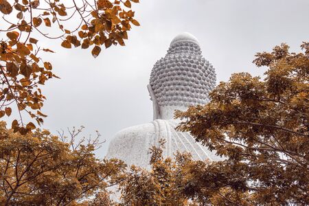 behind the famous white big Buddha statue on a hilltop in Phuket, Thailandの写真素材