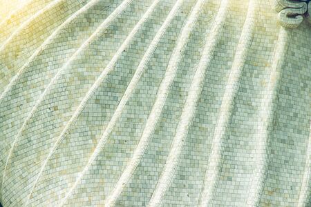 details of the marble mosaic are curly patterns of the part called the yellow robe of a large Buddha...