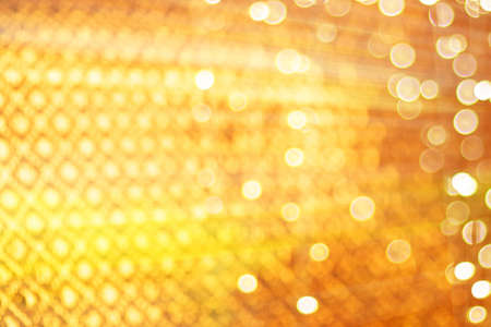 abstract defocused blurred gold glitter vintage lights background
