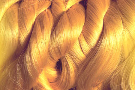 silk threads for traditional weaving, natural yellow raw silk from silk cocoon backgroundの写真素材