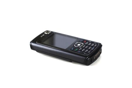 an old black cellphone at isolated background, à¸-à¸® on the keyboard are Thai alphabet.の写真素材