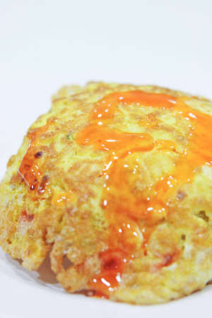 Omelette rice, pork chops topped with chili sauce.