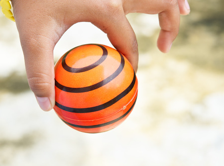 Boy hand with small ballの写真素材