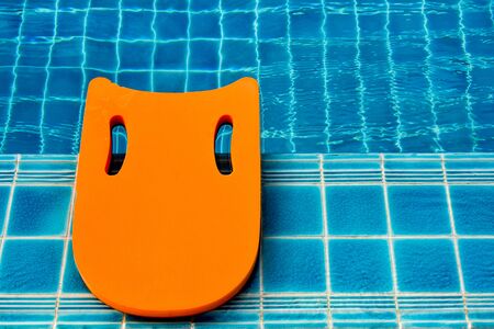 Safety equipment, Life buoy or rescue buoy floating on swimming pool to rescue people from drowning man.の写真素材