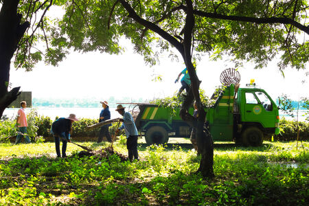 MAHASARAKHAM,THAILAND - SEPTEMBER 19 : Teachers and students together to clean the park on September 19,2014 in Mahasarakham,Thailandのeditorial素材