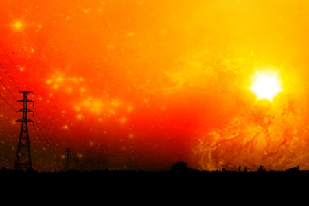 High voltage power pole middle of a cornfield with orange sky and galaxyの写真素材