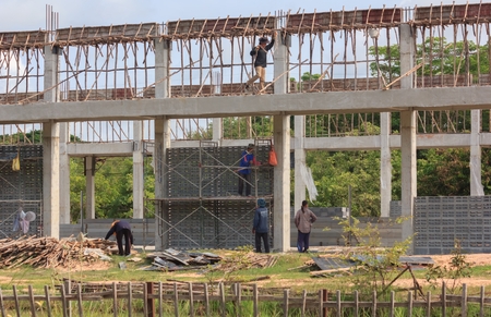 Workers are building the auditorium of the district in Thailand.Mahasarakham,Thailand,July 2016