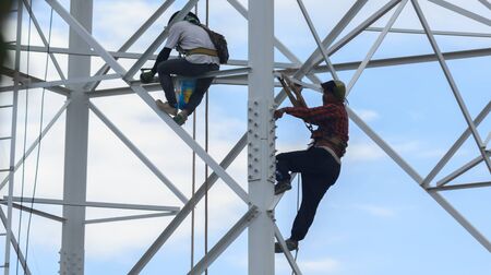Technicians was dismantled tower the phone is due to complaints about health problems.Mahasarakham,Thailand,July 2016のeditorial素材