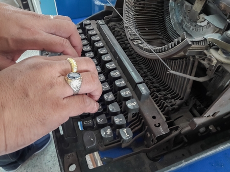 Employees are using an ancient typewriterの写真素材
