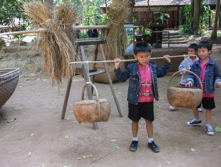 Tourist boy carrying basket.Nakhonratchasima,Thailand,January 2017のeditorial素材