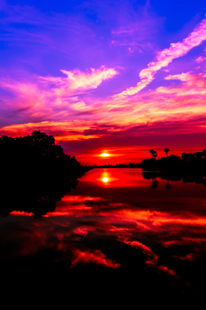 Sunset behind the pond