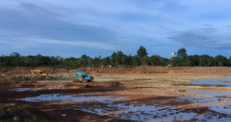 Backhoe're dredging the pond to store water for use during the dry season.Mahasarakham,Thailand,August 2016のeditorial素材