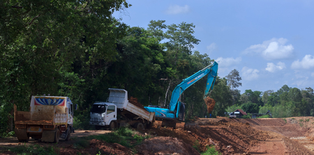 Backhoe're dredging the pond to store water for use during the dry season.Mahasarakham,Thailand,Sebtember 2016のeditorial素材