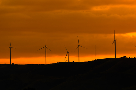 Electric turbine on the mountain at sunsetの写真素材