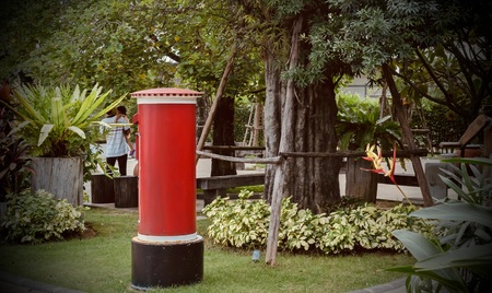 Red mailbox in the garden.