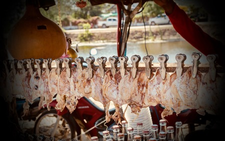 Squid dried on cart for sale to customers.の写真素材