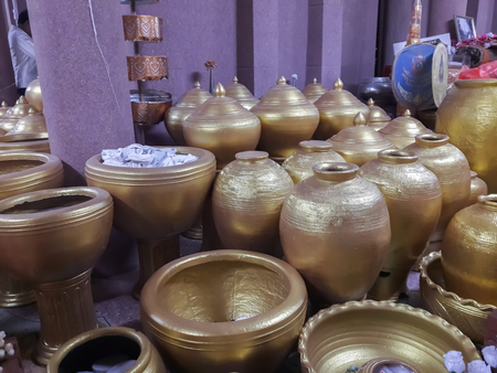 Beautiful golden jar in Thai temple.の写真素材