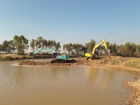 Backhoe is dredging the river for use in the dry season.Mahasarakham,Thailand March 24,2018のeditorial素材