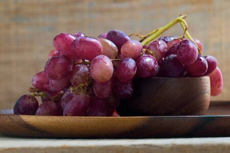 Freshness Grape and wooden plate and backgroundの写真素材