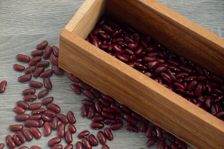 Red Bean in wood box with gray wood backgroundの写真素材